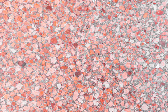 Terrazzo texture with vibrant pink and red stones