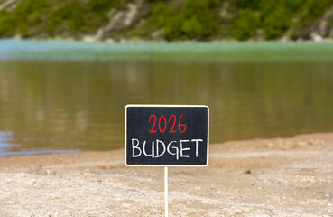 2026 Budget symbol. Concept words 2026 Budget on beautiful black blackboard. Beautiful mountain lake sand beach background. Business and 2026 budget concept. Copy space.