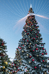 Christmas tree and New Year decorations on the town square on a frosty winter day.
