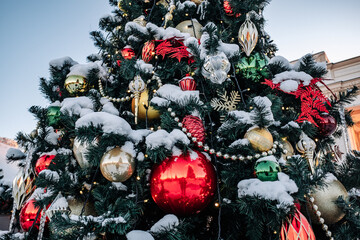 Christmas tree and New Year decorations on the town square on a frosty winter day.