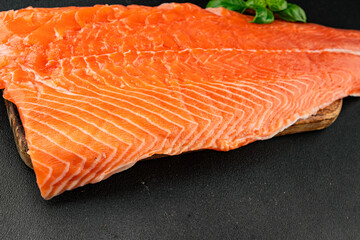 Salmon fillet raw red fish seafood dish natural tasty snack fresh delicious gourmet food background on the table rustic top view copy space pescetarian diet