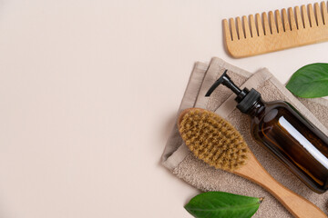 Natural Skincare Products and Body Massage Brush on Light Beige Background Top View