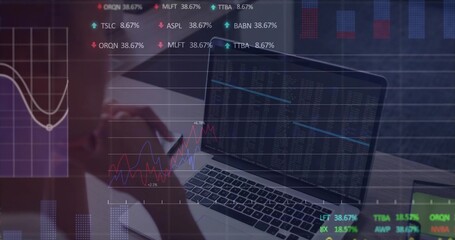 Analyzing woman in fitted top reviewing data overlays in office, with laptop, notebook, pen