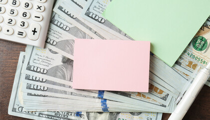Alimony. Paper notes, money, pen and calculator on wooden table, closeup