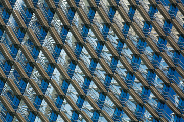 Patterns and colors of building windows and their reflections 
