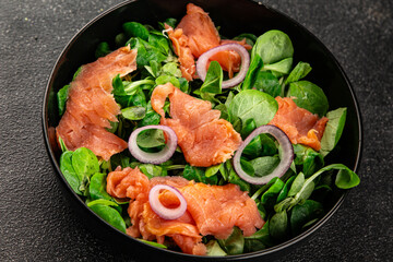 Salmon salad appetizer seafood fresh fish second course portion size natural product tasty snack fresh delicious gourmet food background on the table rustic top view copy space pescetarian diet