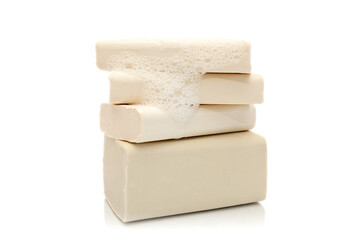 White natural handmade soap with foam on white background.