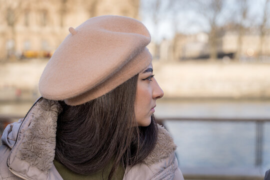 Woman in beret enjoying a winter day in Paris