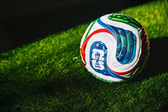 Official FIFA 2026 Trionda soccer ball resting on a grass field &mdash; a global football symbol for the USA, Mexico, and Canada event