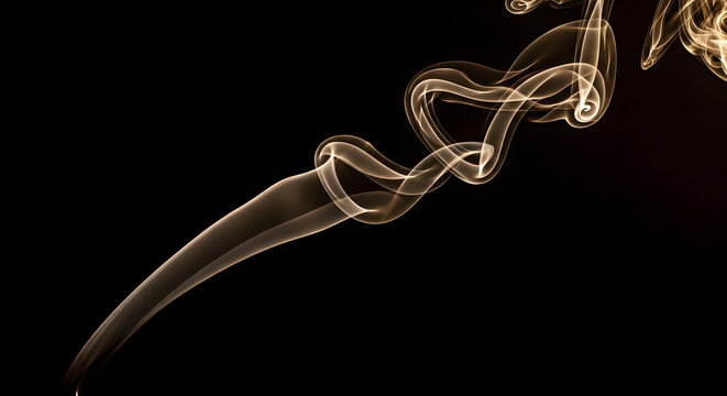 Wisps of golden smoke swirl elegantly against a dark background.