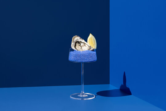 Oyster elegantly served with lemon on Persian blue salt
