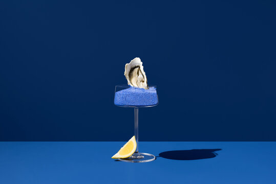 Oyster in cocktail glass with Persian blue salt
