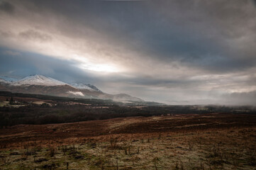 A cold, wintery, misty HDR image of the Nevis Range from the north near Spear Bridge, Lochaber, Scotland.