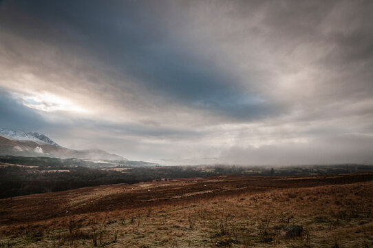 A cold, wintery, misty HDR image of the Nevis Range from the north near Spear Bridge, Lochaber, Scotland.