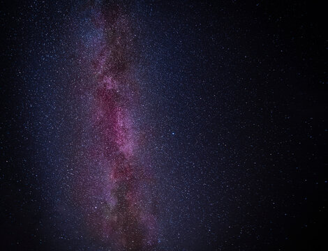 An autumnal HDR image of the clear night sky and Milky way above Fort William, Lochaber, Scotland