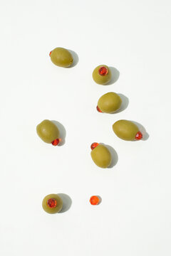 Olives Filled with Glittering Diamonds on White Background