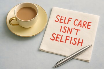 Self care isnt selfish message with a cup of tea and a silver pen
