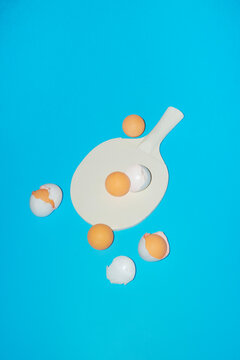 Conceptual image of ping pong paddles with eggs