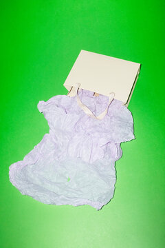 White paper shopping bag on vibrant green background