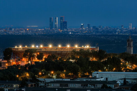 Nighttime view of Colmenar Viejo with Madrid skyline