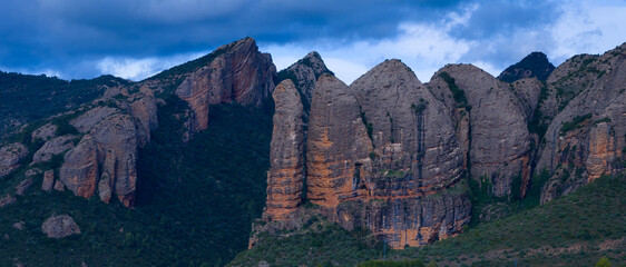 Aerial view from a drone of the village and the Mallos de Ag&uuml;ero mountains in the Hoya de Huesca region. Huesca, Aragon, Spain, Europe