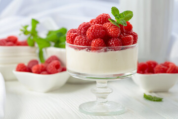 Panna cotta with fresh raspberries.