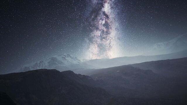In a serene mountain landscape, the night sky is filled with stars and the Milky Way. The peaks reflect the ethereal light, creating a magical atmosphere and inspiring wonder.