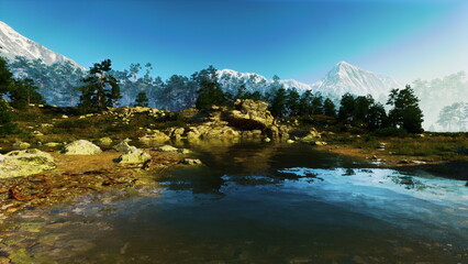 A tranquil lake sits surrounded by vibrant greenery and rocky formations. Majestic mountains rise in the distance, contrasting against a clear blue sky, creating a peaceful scene.