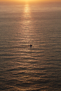 Boat at sunset on the Atlantic Ocean near Galicia