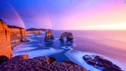 Coastal Sunset - Majestic Rock Formations and Rainbows.