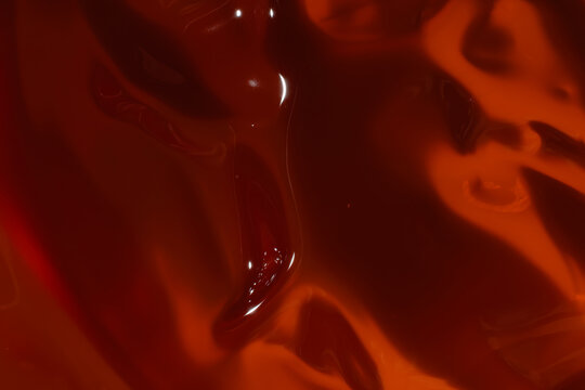 Orange cosmetic gel texture with smooth flow