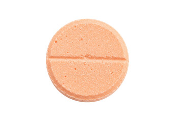 Isolated peach-colored round pill with score line, a pharmaceutical drug for medication use