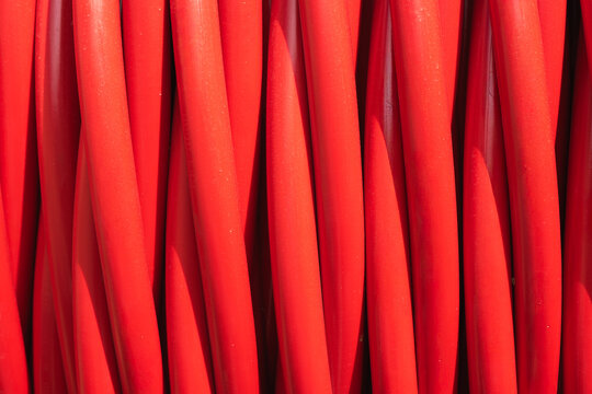 Bright red electrical cables in construction setting