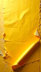 Ripped yellow poster on wall