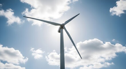 Wind turbine generating clean energy with blue sky and clouds on a sunny day for sustainable future