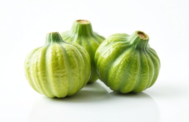 Fresh green chayote squash isolated on white background. Ripe vegetable ingredient in studio. Healthy food object with natural texture. Close-up of raw plant with vibrant color.