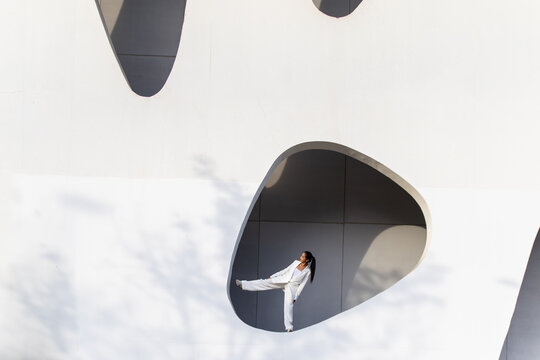 Businesswoman in modern white urban environment