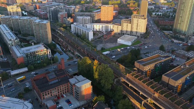 Aerial sunrise video ver Castlefield, Manchester, featuring a tram travelling on the Viaduct and Regent Road traffic. 