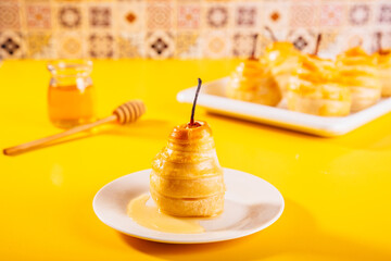 Pears in puff pastry dough drizzled with honey. Healthy and organic food.