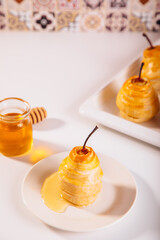 Pears in puff pastry dough drizzled with honey. Healthy and organic food.