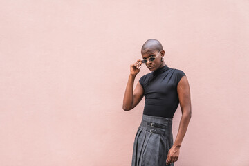 Young LGBTQ man expressing unique fashion style