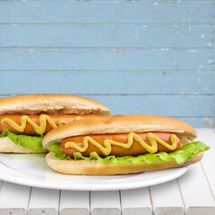 Tasty hot dog with mustard in a soft bun.