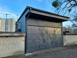 Fototapeta premium Premises for a car service station. The service station has large metal doors