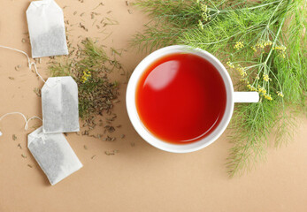 Fennel seed tea with leaves and flowers on beige background, copy space, natural medicine, antiviral treatment, immune booster concept