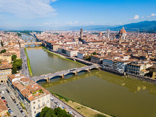 Florence, Italy - aerial view of the Italian tourist city with its historic center, Arno River and its bridges