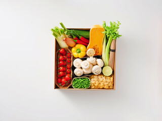 A box displays an assortment of fresh vegetables, cheese, and other ingredients ready for preparation. Bright colors enhance the inviting appearance, making cooking exciting