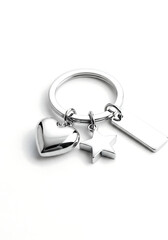 A sleek silver keychain featuring a heart, key, and star charm, perfect for gifts or personal use, showcasing a minimalist and shiny design on a white background.