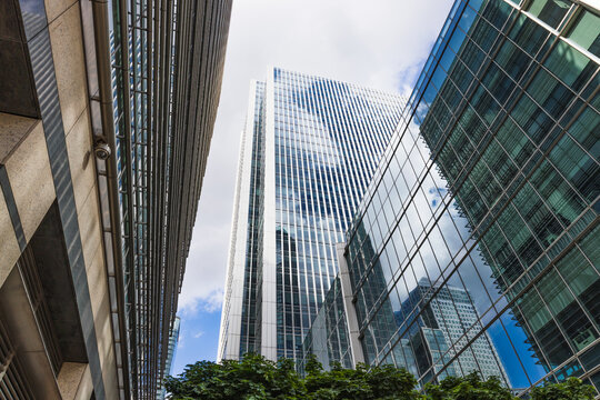 Modern glass skyscrapers in financial district, low angle city architecture perspective