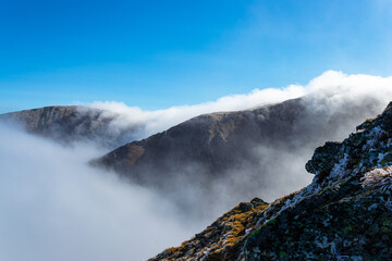 Mountains among cloud in frosty sunshine day