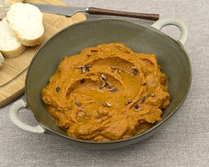A paste made from boiled carrots, roasted sunflower seeds, garrlic, spoon of tomato pure and olive oil.